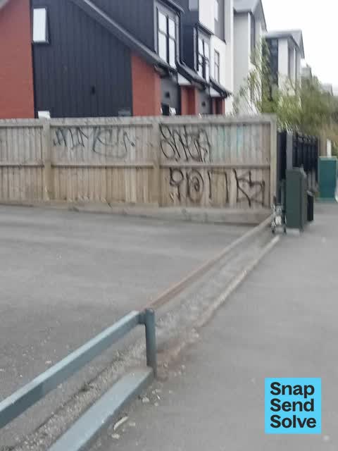 Graffiti on a fence, building or structure, a report photo
