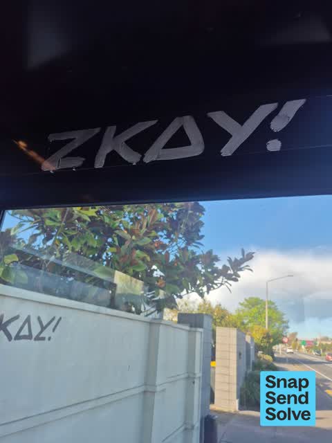 Graffiti on a bus stop or public toilet, a report photo
