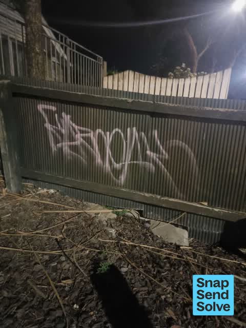 Graffiti on a fence, building or structure, a report photo