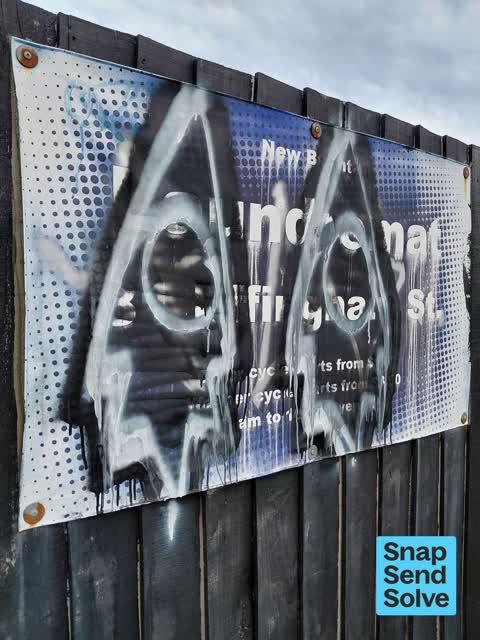 Graffiti on a sign, mural or public art, a report photo