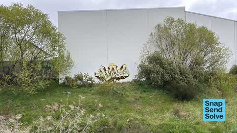 Graffiti on a fence, building or structure, a report photo