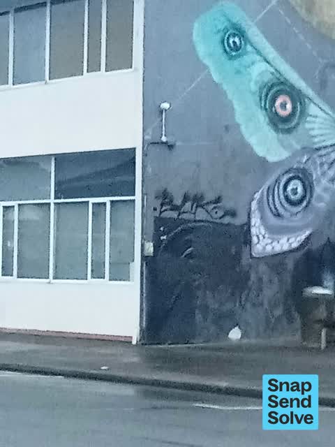 Graffiti on a sign, mural or public art, a report photo