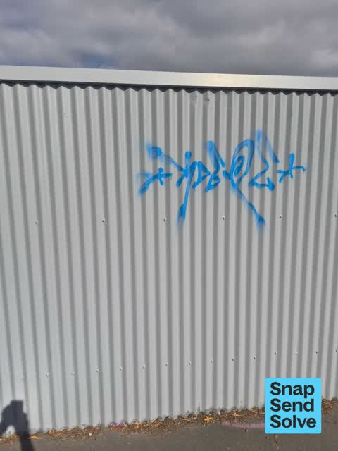 Graffiti on a fence, building or structure, a report photo