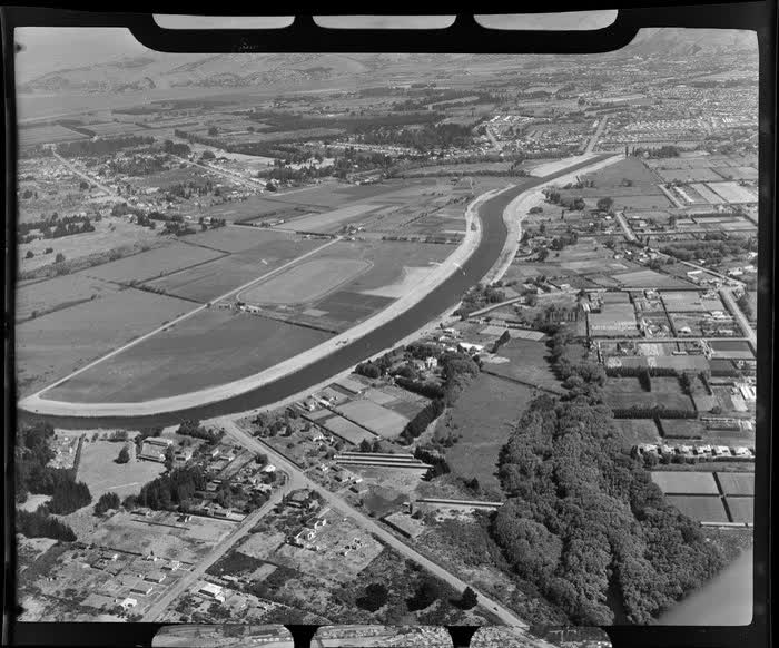 An aerial view of Burwood Primary School, including the construction of New Brighton Road and Avonside Drive, Christchurch, 1950
