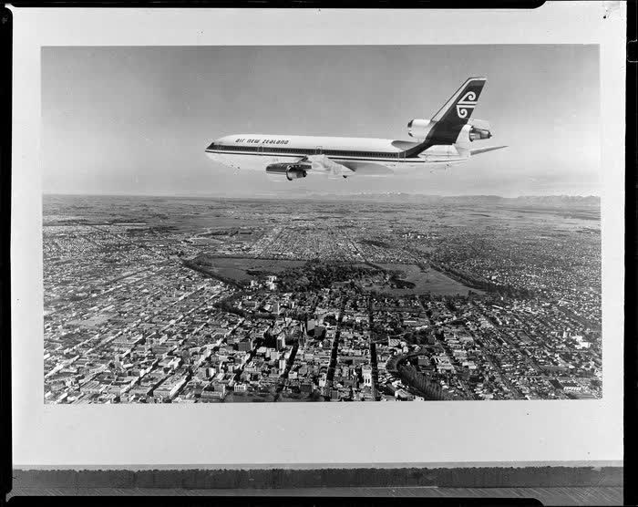 An Air New Zealand DC10 aeroplane over Christchurch, 1974