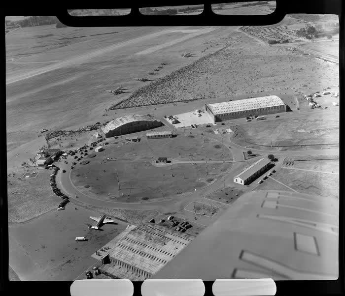 Aerial view of aircraft and spectators at the dedication of Harewood Airport, Christchurch, 1950