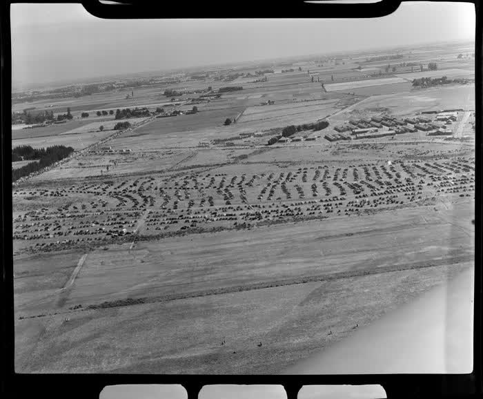 Aerial view of cars parked on airfield, dedication of Harewood Airport, Christchurch, 1950