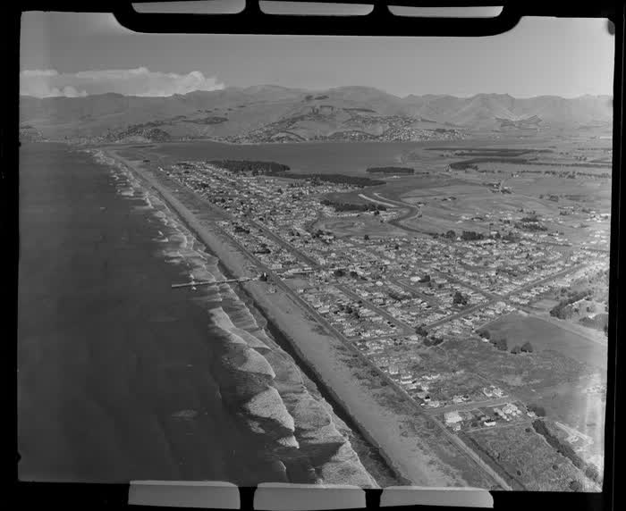 Coastal view of New Brighton, Christchurch City, Canterbury Region, including pier, Avon River, and Avon Heathcote Estuary, 1951