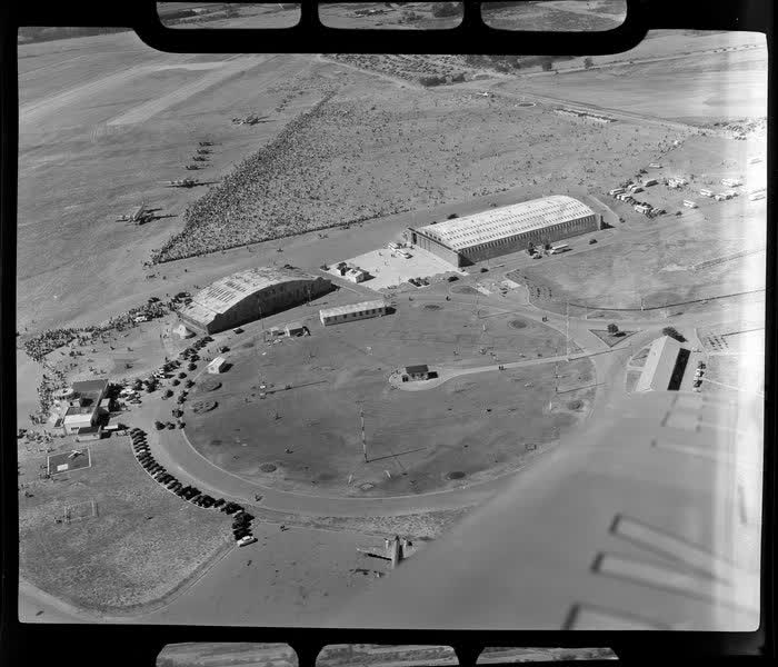 Aerial view of aircraft and spectators at the dedication of Harewood Airport, Christchurch, 1950