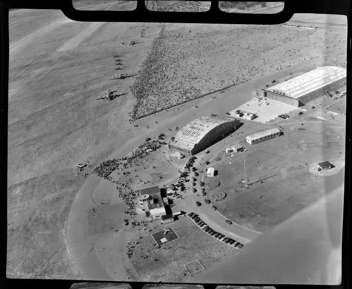 Aerial view of aircraft and spectators at the dedication of Harewood Airport, Christchurch, 1950