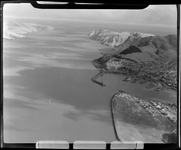 The port town of Lyttelton looking to Godley Head and Lyttelton Harbour entrance, Christchurch City, Canterbury Region, 1947