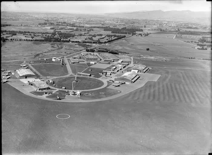 View of Harewood Aerodrome (Christchurch International Airport) with planes, hangars and buildings, Canterbury, 1946