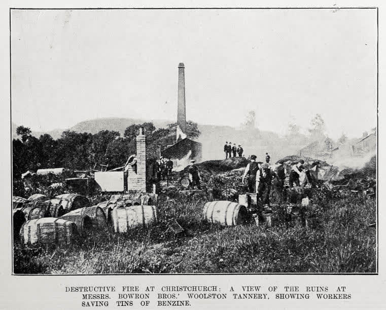 DESTRUCTIVE FIRE AT CHRISTCHURCH: A VIEW OF THE RUINS AT MESSRS. BOWRON BROS.' WOOLSTON TANNERY, SHOWING WORKERS SAVING TINS OF BENZINE, 1905