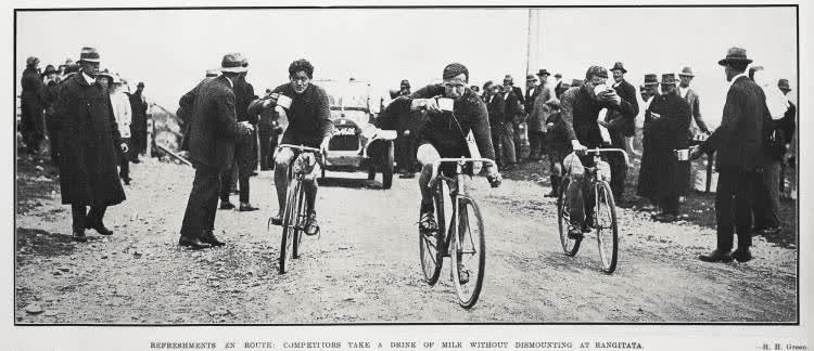 Refreshments en route: competitors take a drink of milk without dismounting at Rangitata, 1924
