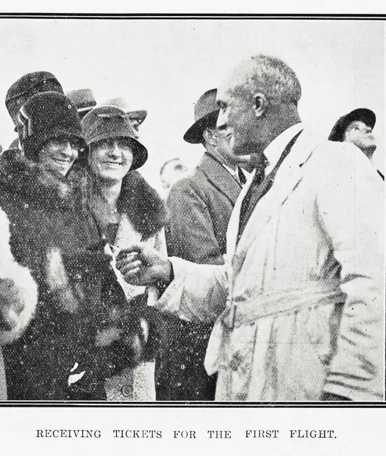 Receiving tickets for the first flight, 1929