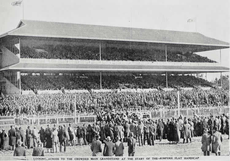 Looking across to the crowded main grandstand at the start of the Jumpers: flat handicap, 1936