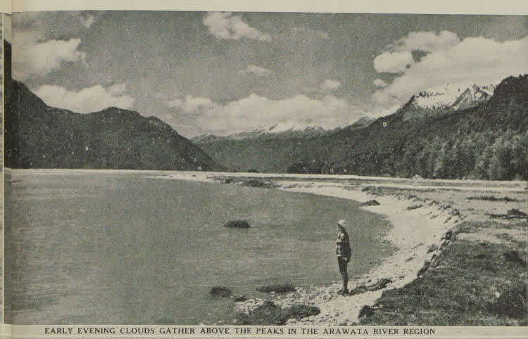 A woman standing on the banks of the Arawata River, 1938