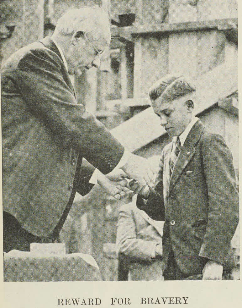 The Honourable Peter Fraser presents a medal to William Gorely for saving a girl from drowning at New Brighton beach, 1938
