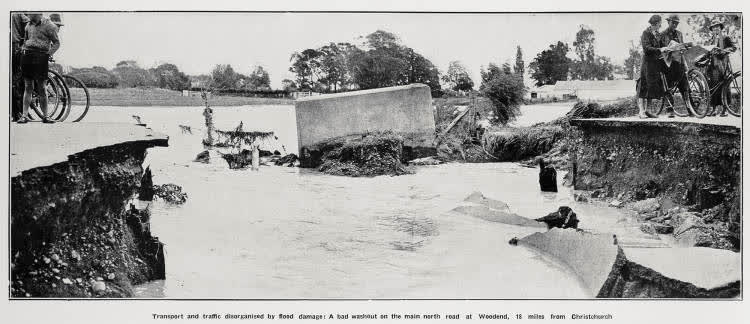 Transport and traffic disorganised by flood damage: a bad washout on the main north road at Woodend, 18 miles from Christchurch, 1936