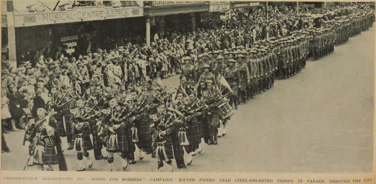 Christchurch inaugurates its 'bonds for bombers' campaign: kilted pipers lead steel-helmeted troops in parade through the city, 1942