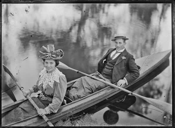Man and woman in a double canoe on the Avon River, 1900