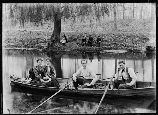 Two men and two women in a double rowboat on the Avon River, 1900