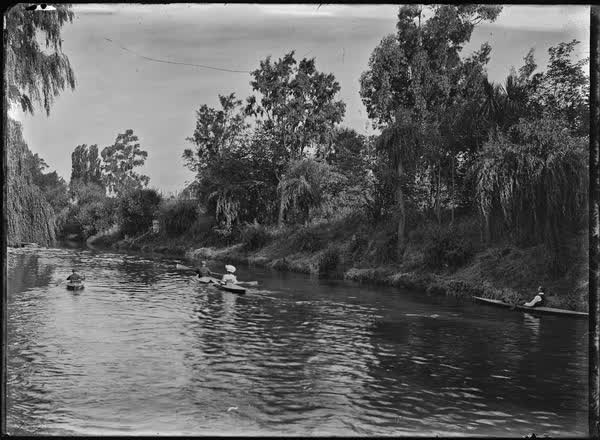 The Avon River with men and women canoeing, 1900
