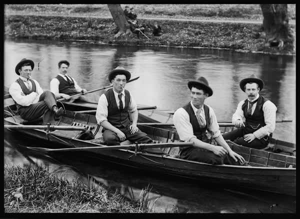 Five men in a rowboat and canoes on the Avon River, 1900