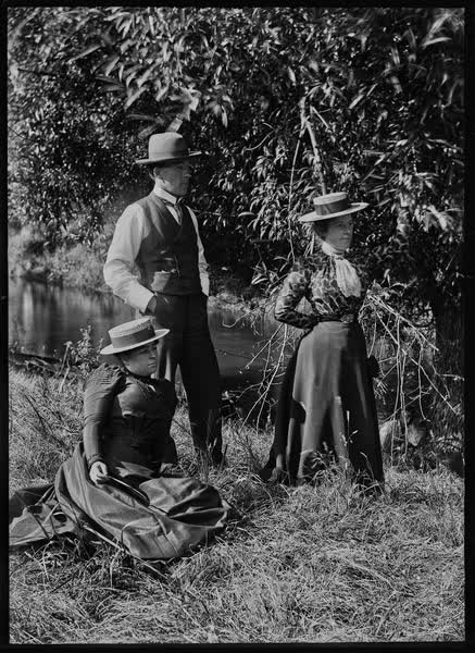Man and two women in Hagley Park, 1900