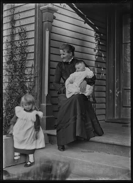 Woman with baby and young child, 1900