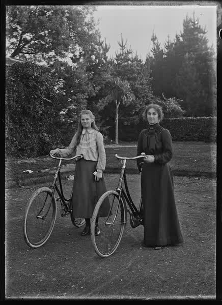 Woman and girl with bicycles, 1900