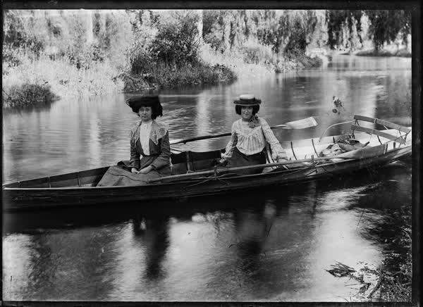 Two women in a large rowboat on the Avon River, 1900