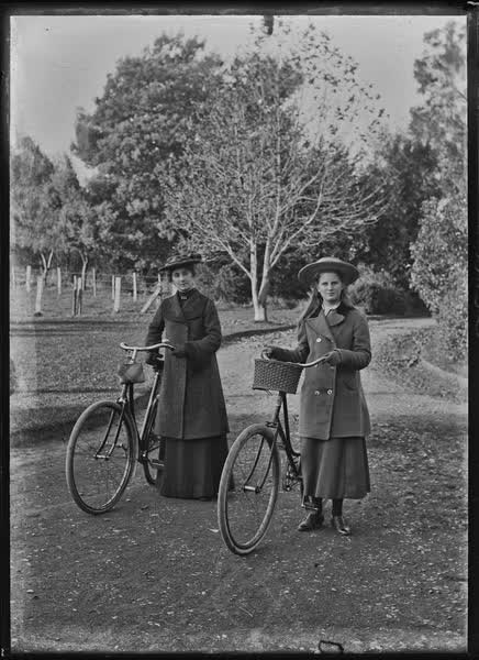 Woman and girl with bicycles, 1900