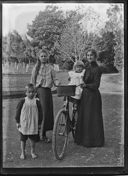 Woman, teenage girl and two children, 1900