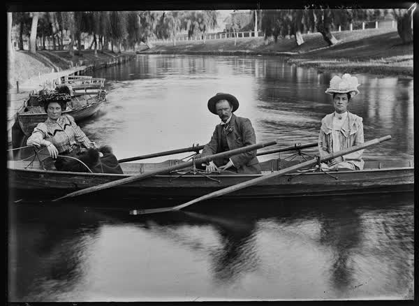 Two women and a man in a rowboat, January, 1904, 1904
