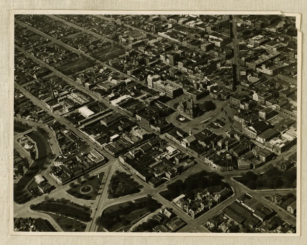 Aerial view, showing site of new office building, 1937