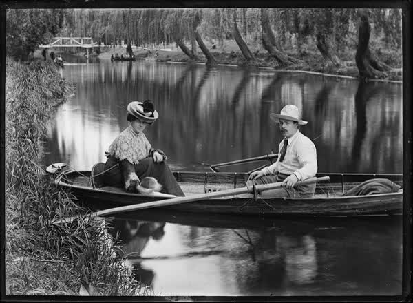 Man, woman and dog in a rowboat on the Avon River, 1900