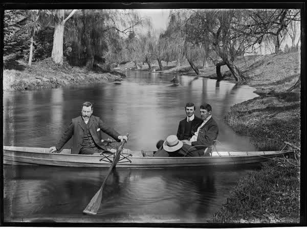 Three men in a rowboat on the Avon River, 1900