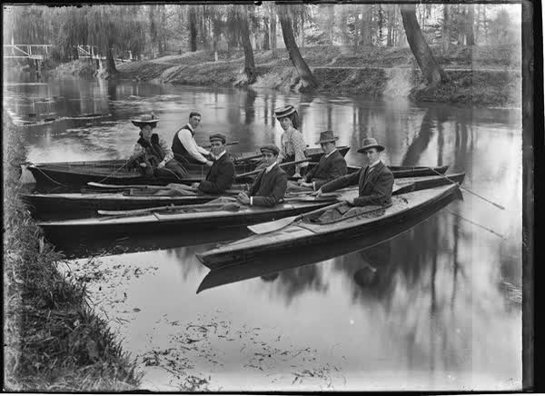 Five men and two women in canoes and rowboats on the Avon River, 1900