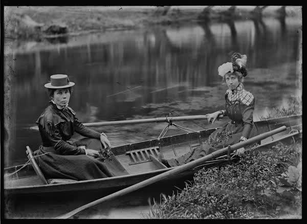 Two women in a rowboat on the Avon River, 1900