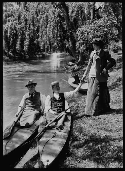 Two men and a woman with canoes on the Avon River, 1900