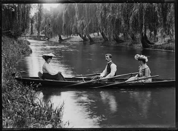 Two women and a man in a rowboat on the Avon River, 1900