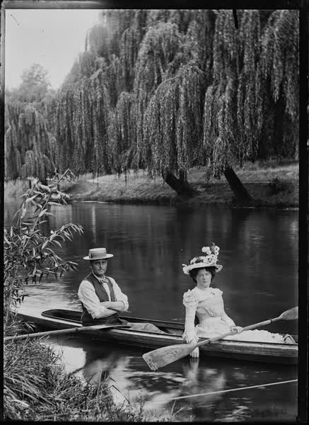 Man and woman in a double canoe on the Avon River, 1900