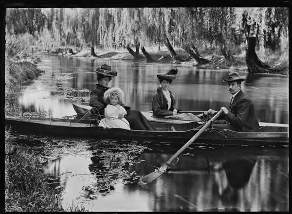 Man, two women and a child in two rowboats on the Avon River, 1900