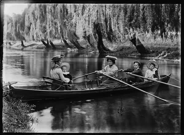 Two women with young and older children on the Avon River, 1900
