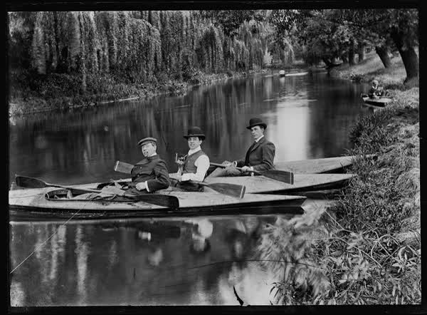 Three men in canoes on the Avon River, 1900