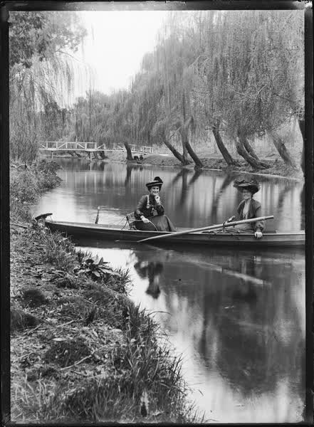 Two women in a rowboat on the Avon River, 1900