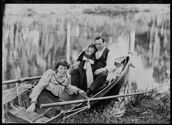 Man, woman and girl in a rowboat on the Avon River, 1900