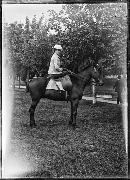 Woman riding a horse in Hagley Park, 1900