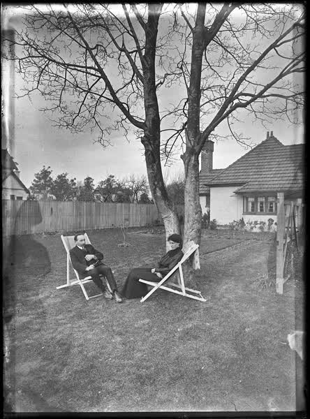 Man and woman in canvas deckchairs, 1900